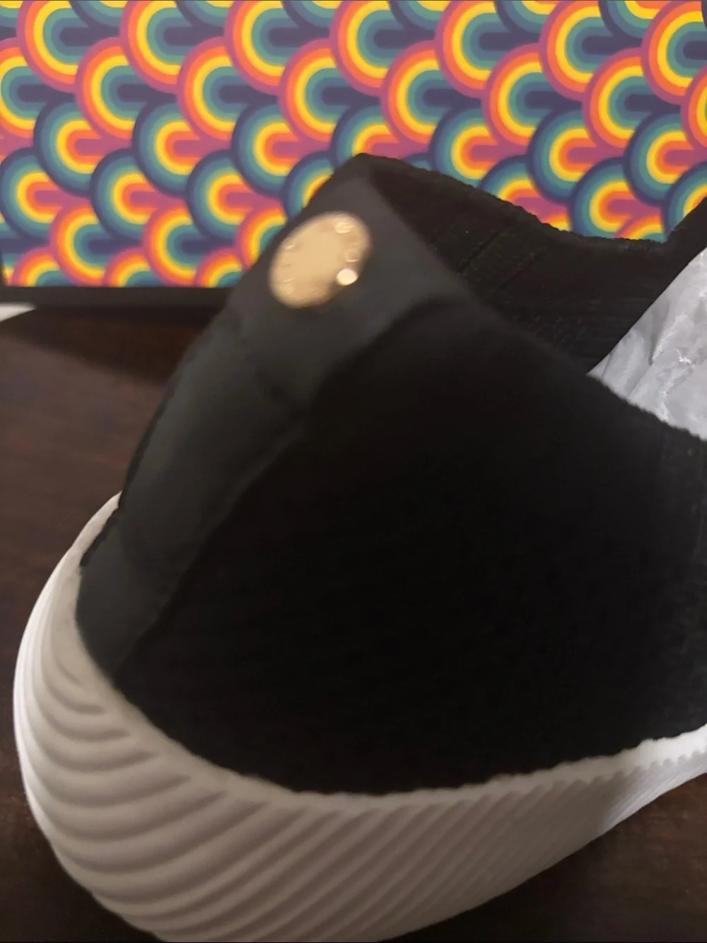 Kurt Geiger Black Knit Slip-On Sneakers with Gold Emblem